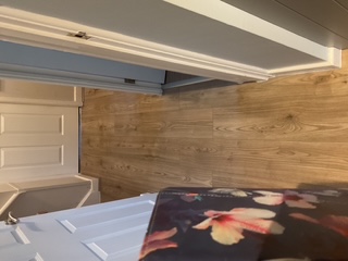 Warm oak laminate flooring running through a hallway
