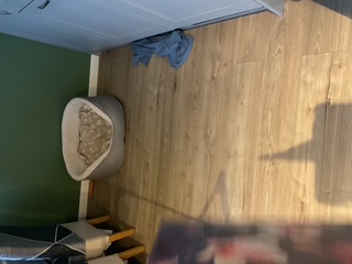 Light oak laminate flooring fitted in a living room